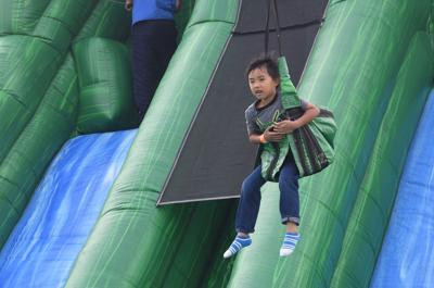 Children's Festival - child on bouncy castle