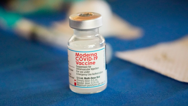 A vial of the Moderna COVID-19 vaccine rests on a table at an inoculation station next to Jackson State University in Jackson, Miss., Tuesday, July 19, 2022. (AP Photo/Rogelio V. Solis, File)