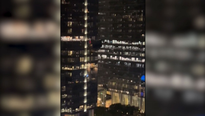 Calgary police say they are investigating after a group of people were base jumping in the downtown core on Thursday night. (Supplied/Reddit)