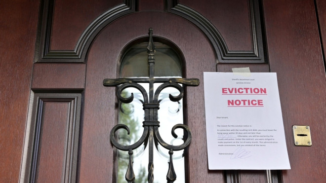 This stock image shows a door with an eviction notice on it. (Credit: Shutterstock)