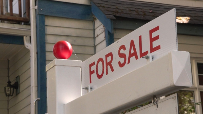 A for sale sign is seen outside a home in East Vancouver on Saturday, Sept. 16, 2023. (CTV)