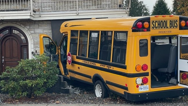 A school bus crashed into a home in Burnaby, B.C. on Thursday, Nov. 9, 2023. 