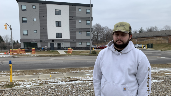 Construction worker Jacob Hurl, seen on Jan. 8, 2024, stands in front of 555 Teeple Terrace in London where he was critically injured on Dec. 11, 2020 when the building partially collapsed. (Bryan Bicknell/CTV News London) 