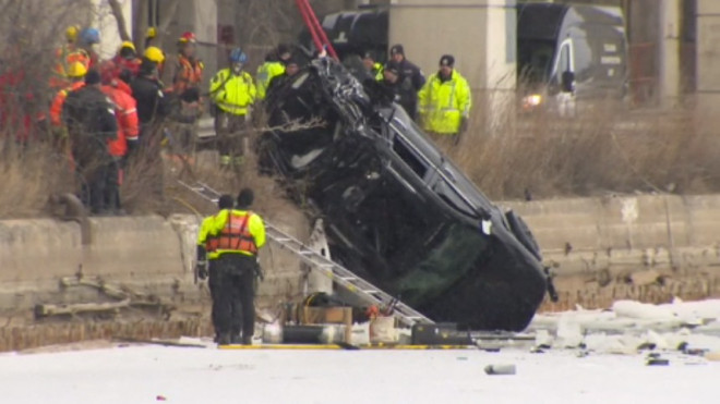 A vehicle is pulled from the icy waters of the Keating Channel in Toronto's harbour