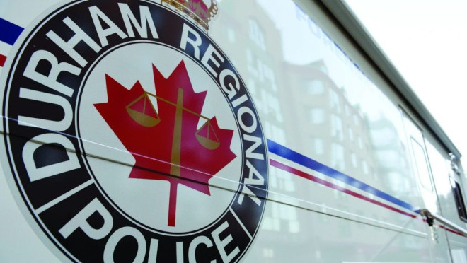 A Durham Regional Police Service forensics vehicle is shown.