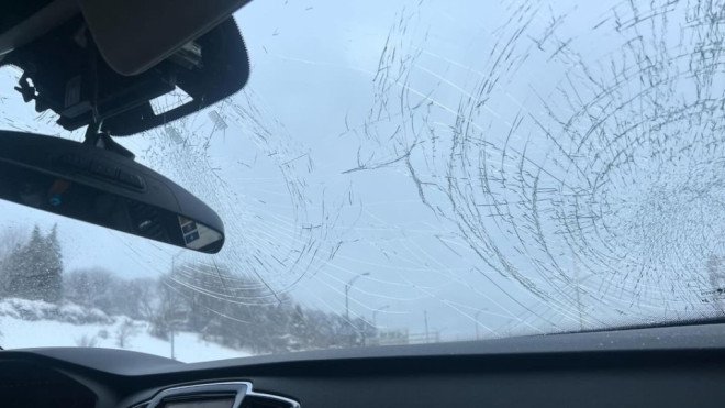 A vehicle's windshield was smashed when a piece of a pothole smashed into in while a couple was driving on Highway 40. (Hillary Cohen)