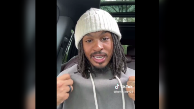 American food critic Keith Lee shows off a hat and hoodie he's wearing in preparation for an upcoming visit to Toronto in an April 2 video on social media. (Keith_Lee129/TikTok)