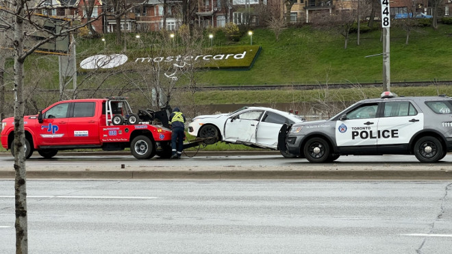 Thedriver of a vehicle crashed into 2 light posts on Lake Shore Boulevard early Saturday morning on April 13, causing the roads in the area to close temporarily. (Simon Sheehan / CP24) 