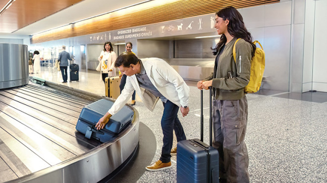 People collecting their luggage