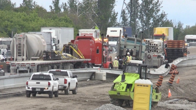 Crews work on a damaged guardrail following a collision on Highway 400 in York Region on Tues., May 28, 2024. (CTV News/Steve Mansbridge)