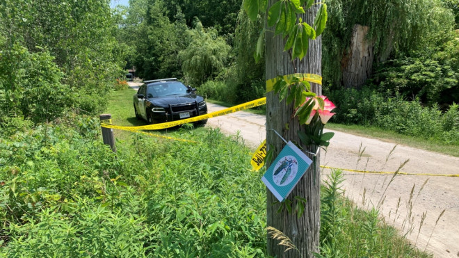 Flowers for the victims in a death investigation in Harrow, Ont., on Friday, June 21, 2024. (Bob Bellacicco/CTV News Windsor)