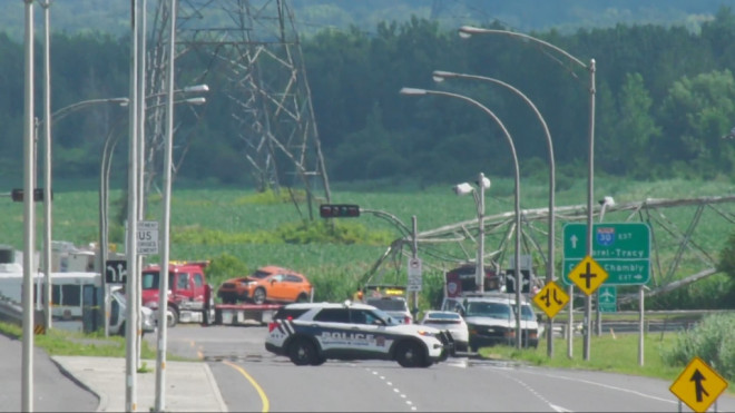 A downed hydro tower near Highway 30 on Montreal's South Shore on Saturday, July 7, 2024, after a collision the night before. (Dave Touniou/CTV News)