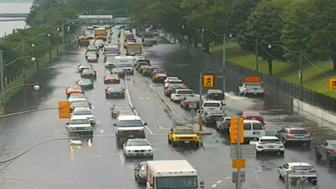 Water is shown on Lake Shore Boulevard following heavy rain on July 24. 