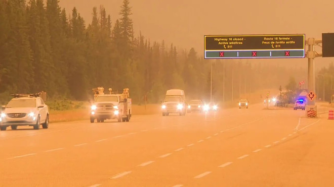 First responders and other personnel driving east out of Jasper National Park the evening of Wednesday, July 24, 2024.