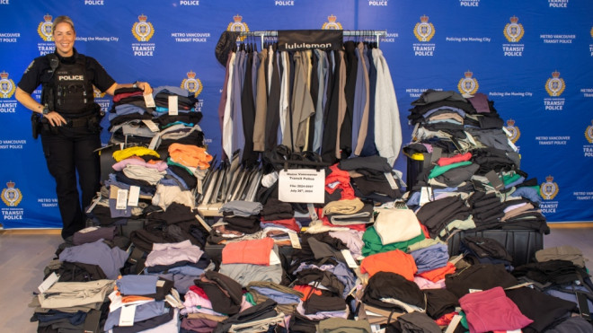 Metro Vancouver Transit Police display more than 800 clothing items from Lululemon that were seized from a home in Burnaby, B.C., (Handout) 