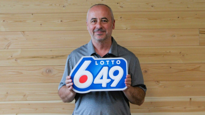 Edmond Beti is one of seven Calgary coworkers who won $5M on Lotto 6-49. (WCLC) 