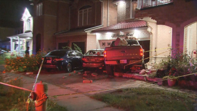 A pickup truck is pictured after it crashed into a homes on Staines Road in Scarborough Saturday September 1, 2024. 