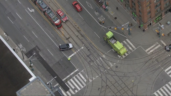 King Street and Spadina Avenue is closed after a garbage truck struck overhead TTC wires on Dec. 17, 2024.