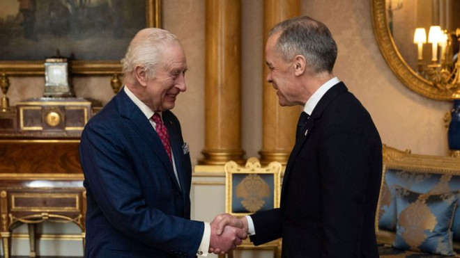 King Charles III, left, holds an audience with Canada's Prime Minister Mark Carney, right, at Buckingham Palace in London, England, Monday, March 17, 2025. (Aaron Chown/PA via AP, Pool)