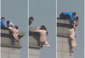 惊！妙龄女悬挂19楼顶 长发被抓“一秒拉回人间”