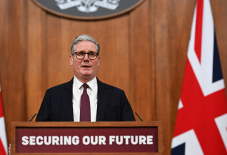 英首相称做好战斗准备 警告俄中挑战