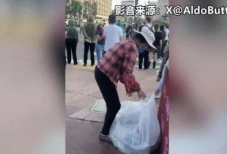 无视身旁“打”“砸”暴乱 华人大妈淡定捡废瓶