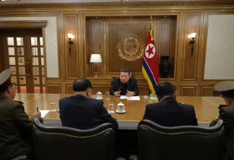 金正恩会见核部门科技人员,指导核武器生产协议会
