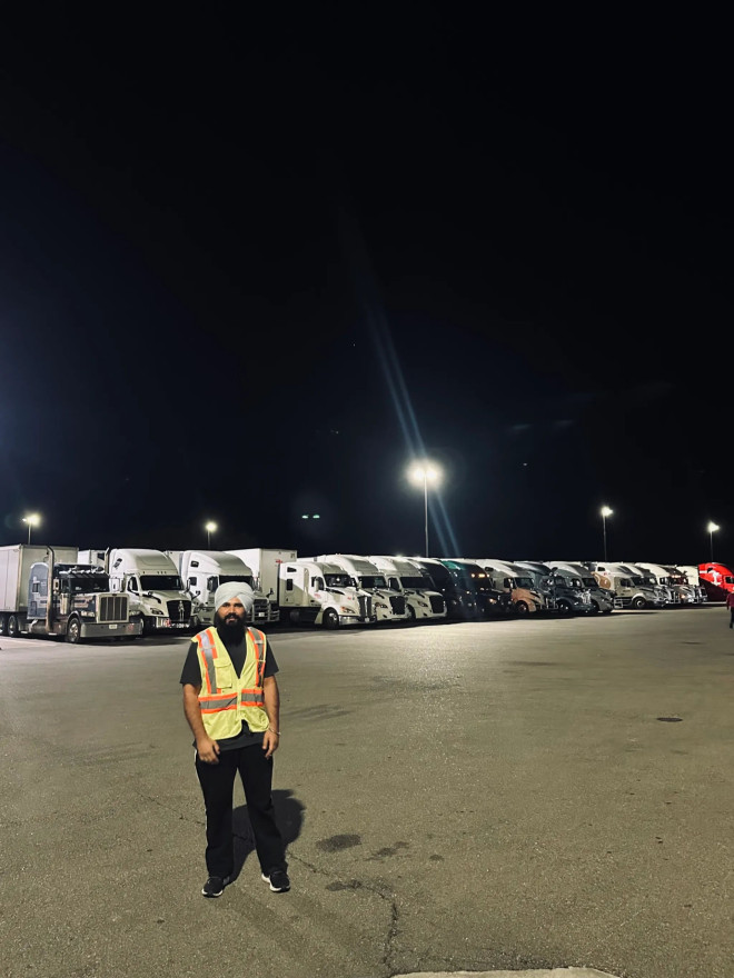 Kiratsimran Deol is among dozens of Canada-bound truckers parked at a gas station on the I-90, waiting for the border backlog to clear.