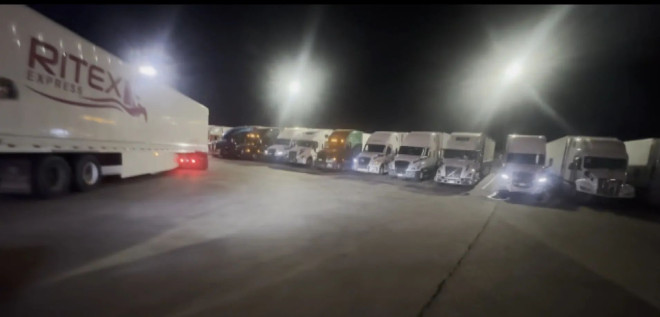 Dozens of Canada-bound trucks parked at a gas station in Ripley, New York Thursday waiting for the border backlog to clear.
