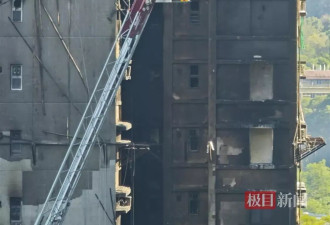 现场实拍：香港起火大楼楼体焦黑 棚网几乎被烧光