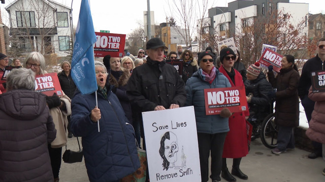 Supporters of public health care gathered outside Calgary Liberal MP Corey Hogan's office on Monday, one of more than a dozen similar rallies held across Canada.