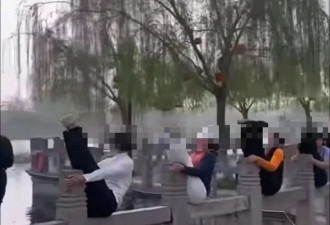 河南百泉景区内多人在水边护栏上做瑜伽,景区:已出面制止