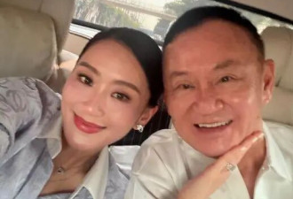 他信出狱后首度现身，与小女儿佩通坦牵手逛街