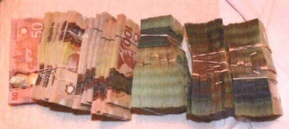 A photo entered as evidence shows wads of money, among more than $130,000 seized by RCMP from a bedroom safe in the Scarborough home of Kypros (Kyp) Perikleous. RCMP